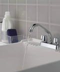 2-Handle Centerset Utility Sink Faucet in Chrome, Built Tough, in a laundry room installation with flowing water