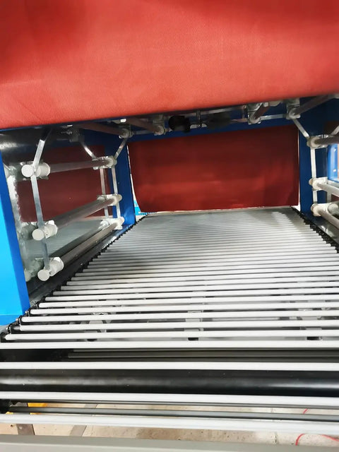 Interior view of No Fuss Thermal Heat Shrink Packaging Machine Tunnel with digital temp control and conveyor rollers.