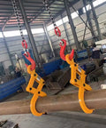 Two Heavy Duty Vertical Plate Lifting Clamps gripping a steel beam, designed for tough construction with a 3.1 ton capacity.