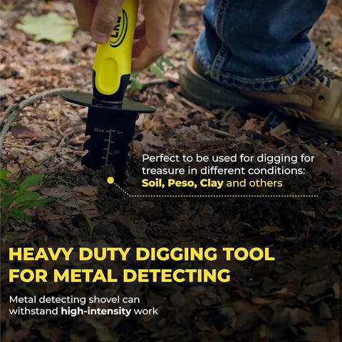 A person using the Beefy Heavy Duty Metal Detector Shovel With Double Serrated Edge And Sheath for treasure hunting in soil.
