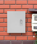 Beefy Built Tough Power Distribution Box Metal Enclosure With Lid 25x30x14 Cm mounted on a red brick wall outdoors