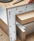 Solid As A Rock Stainless Steel L Shaped Square Ruler featuring Dead On 4 By 6 Inch dual side etchings measuring wood pieces.