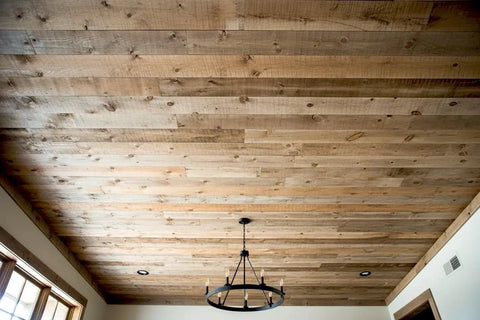 Badass Saddlewood Reactive Wood Stain In Colonial Brown used on a rustic wood ceiling with natural grain depth.
