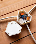 Openable DIY Junction Box For Branch Wire Splices, Three-Wire Electrical Enclosure With Cover, white plastic on wood floor