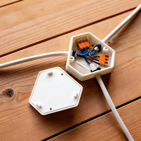 Openable DIY Junction Box For Branch Wire Splices, Three-Wire Electrical Enclosure With Cover, white plastic on wood floor