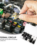 Hand using tool to apply All In One External Circlip Retaining Rings Kit With 328 Pieces In Black Manganese Steel in fuse box