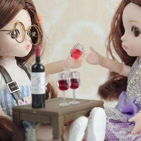 Hella Cool Miniature Red Wine Bottle Set Featuring Two Resin Filled Wine Glasses And A Static Corkscrew for dollhouse decor.
