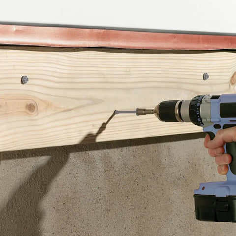 Drilling Three And Five Eighths Inch Lag Screw With Built In Washer Hex Head For Easy Code Compliance ESR 1078 into wood beam
