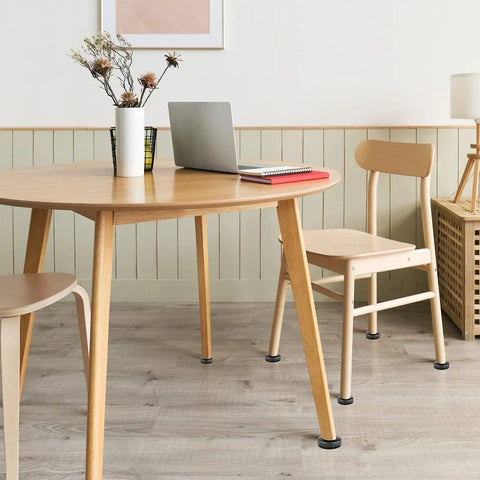 Table and chairs with Three Eighth Inch Thread Leg Levelers 24 Pack Beefy Heavy Duty Adjustable Furniture Feet visible on legs.
