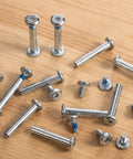 10 Pack Inline Skate Axle Screws 6mm x 36mm for roller skates displayed on a wooden surface