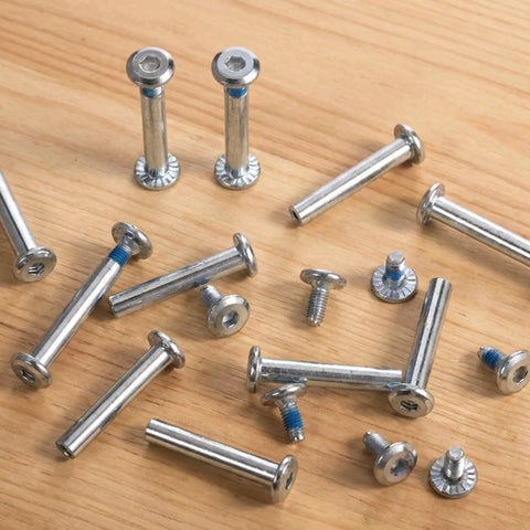 10 Pack Inline Skate Axle Screws 6mm x 36mm for roller skates displayed on a wooden surface