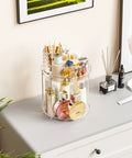 Totally Slick No Hassle 360 Spin Vanity Organizer Two Tier Clear Acrylic Rotating Storage For Perfume And Lotion Lazy Susan Beauty Stand Keeps Skincare Fully Within Reach On Any Desk with lotions and cosmetics on a gray surface.