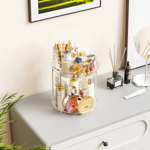 Totally Slick No Hassle 360 Spin Vanity Organizer Two Tier Clear Acrylic Rotating Storage For Perfume And Lotion Lazy Susan Beauty Stand Keeps Skincare Fully Within Reach On Any Desk with lotions and cosmetics on a gray surface.