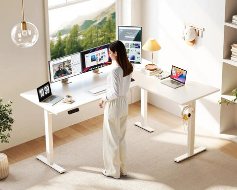 Person using 63 Inch Sit To Stand Electric L Shaped Desk With Height Adjustment Range 27.9 To 46.1 Inches, Reversible Corner Setup