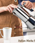 Pouring coffee from Stovetop Espresso Maker 6 Cup Moka Pot In Stainless Steel For Cuban Cafetera Cubana And Greca De Cafe Induction Compatible 10 Ounce Coffee Pot For Home Travel And Everyday Brews into a cup
