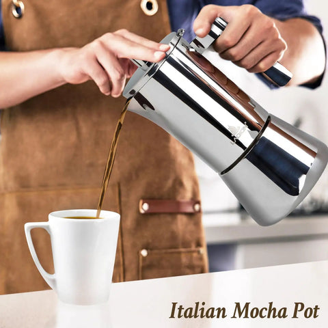 Pouring coffee from Stovetop Espresso Maker 6 Cup Moka Pot In Stainless Steel For Cuban Cafetera Cubana And Greca De Cafe Induction Compatible 10 Ounce Coffee Pot For Home Travel And Everyday Brews into a cup