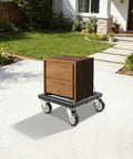 Heavy Duty Furniture Dolly With Smooth Rolling Locking Casters, Rock Solid Steel Folding Moving Platform, No Sweat Collapsible Hand Truck For Quick Sofa And Machine Moving, 1200 Lb Capacity carrying a wooden drawer cabinet outdoors.