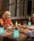 Four Pack Refillable Table Top Citronella Torches With Glass Canisters 12 Oz Each Blue Outdoor Lighting for a patio dinner