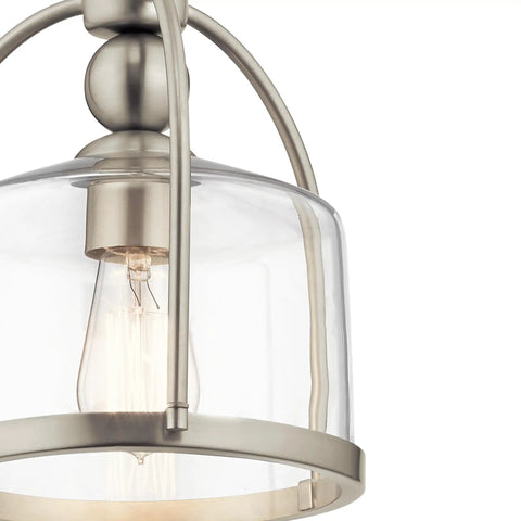 Close-up of One Light Mini Pendant In Brushed Nickel, Cool Modern Steel Fixture with clear glass shade, 75W bulb socket visible.