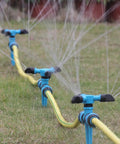 Three 360 Degree Rotating Lawn Sprinklers For Large Area Coverage With Adjustable Spray Directions on grass