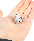 Upgrade Your 3D Printer With This Sweet Kit Of Six Gt2 Timing Belt Pulleys Featuring A Solid Aluminum Build And 20 Teeth Designed To Stop Slipping And Boost Power Transfer For Super Smooth Printing Plus Comes With A Hex Wrench For Easy Install. Three silver 20-tooth aluminum GT2 timing belt pulleys in a hand
