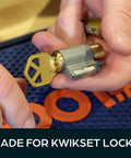 Person holding a lock cylinder with key from Pro Grade Rekey Kit With 50 Master Pins 50 Bottom Pins And 50 Top Pins And 50 Springs