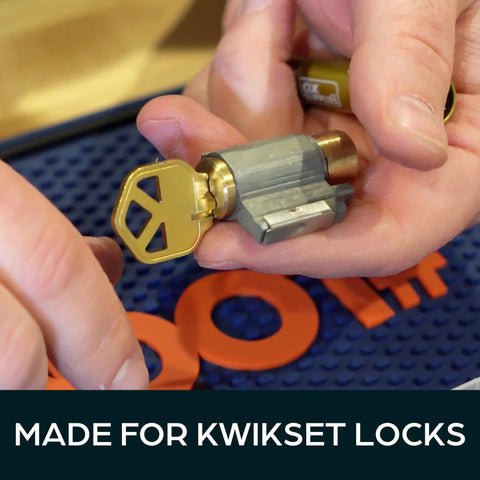 Person holding a lock cylinder with key from Pro Grade Rekey Kit With 50 Master Pins 50 Bottom Pins And 50 Top Pins And 50 Springs