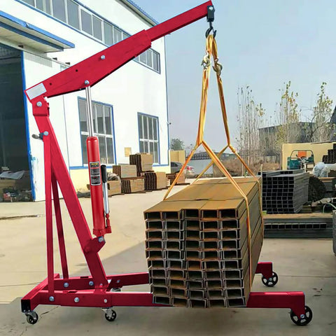 Red hydraulic long-ram jack with single-piston pump on a wheeled base, side view lifting a bundle of metal beams.