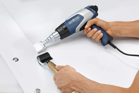 Heavy Duty 2200W Hot Air Gun With Variable Temperature 60C To 630C being used for plastic welding, showing LCD display and controls.
