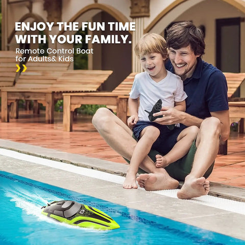 Father and child enjoying a 14-Inch High Speed RC Boat For Pools And Lakes Delivers Over 20 MPH Action, Auto Self Righting