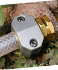 Top Quality Garden Hose Repair Kit featuring 3 Sets Of Durable Aluminum Alloy Connectors That Fight Rust And Stop Leaks For Sturdy Outdoor Water Setup. Flexible brass hose repair connector on clear tubing, gray aluminum clamp and brass fitting.