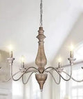 French Country 6 Light Farmhouse Chandelier With Imitation Wood Finish cozy homey rustic candle chandeliers in room