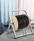 Heavy Duty Steel Cable Caddy And Wire Spool Rack Dispenser For Reels Up To 100 Lb, portable with wooden spool holding black cable