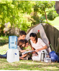 Family camping with Portable Water Dispenser And Compact Bucket Holder Faucet For Outdoor Camping And RV Use beside tent