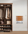 Folding Shower Seat Wall Mounted Bench Teak Wood Chair With 350 Lb Capacity next to closet, folded against wall.
