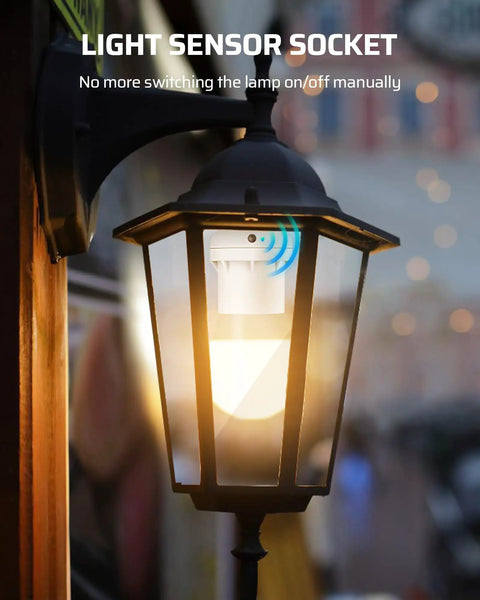 Light Sensor Socket Adapter E26 E27 Dusk To Dawn Automatic Sensor installed in an outdoor wall lantern glowing at dusk