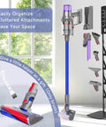 Universal Storage Stand For Dyson And Most Cordless Vacuums With A Heavy Duty Carbon Steel Base in black, wall-mounted with attachments.