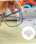 Person repairing rimless glasses with Metal Eyeglass Frame Washers 200 Pcs Set for Rimless Glasses, Quick Fix Repair Accessories.