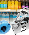 No Sweat Manual Round Bottle Labeling Machine And Adjustable Label Applicator For Small Biz handles labels on beverages.