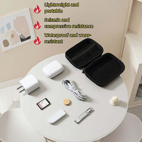 Road Ready Hard Shell Tech Organizer Case With Water Repellent Coating And Shock Absorbing Build designed for packing cables and chargers on a table.