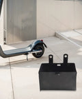 Heavy Duty Beefy Battery Storage Box For 50Cc 70Cc 110Cc 125Cc Atv Quad Dirt Bike Trail Riding Off Road Knockout Impact Protection Mount Case 4 8 X 2 76 Inches beside an electric scooter on pavement.