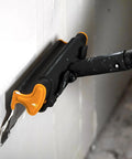 Pro Grade 16 Inch Drywall Skimming Blade With Extruded Aluminum Back And European Stainless Steel Blades in use on wall