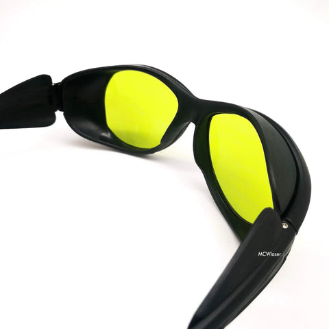 Heavy Duty Laser Safety Goggles Lock Down Eye Protection From UV IR And Blue Light Across 190 To 10600 Nanometers with yellow lenses.