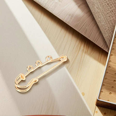 Top Shelf Loop Safety Pin Brooch Set Of Twenty Pieces Electroplated In Rich Golden Tone For Sweaters Coats And Jackets Featuring Reliable Non Slip Clasp, detailed view of one safety pin.
