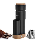 Wirsh Geimori T38 Plus Portable Electric Burr Coffee Grinder With Stepless Conical Burrs, palm sized black metal body and wooden base.