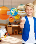 Boy giving thumbs up with Nine Giant Inflatable Solar System Planets With Pump For Ceiling Decor in bedroom display