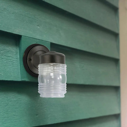 Level Up Your Porch With This Classic Jelly Jar Outdoor Wall Light In Sleek Matte Black, 5x7 ribbed glass fixture.