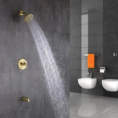 Brushed Gold Tub And Shower Faucet Set With Pressure Balancing Valve And Trim Included in a modern bathroom setting
