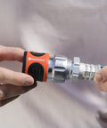 Person holding premium metal quick connect hose fittings set for five eighths or half inch hoses no kink easy watertight quick connect kit