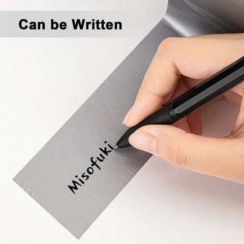 Person writing on Heavy Duty Waterproof Duct Tape 2 Inch By 30 Yards Six Roll Multipack For Indoor Outdoor Use, showing writeability.